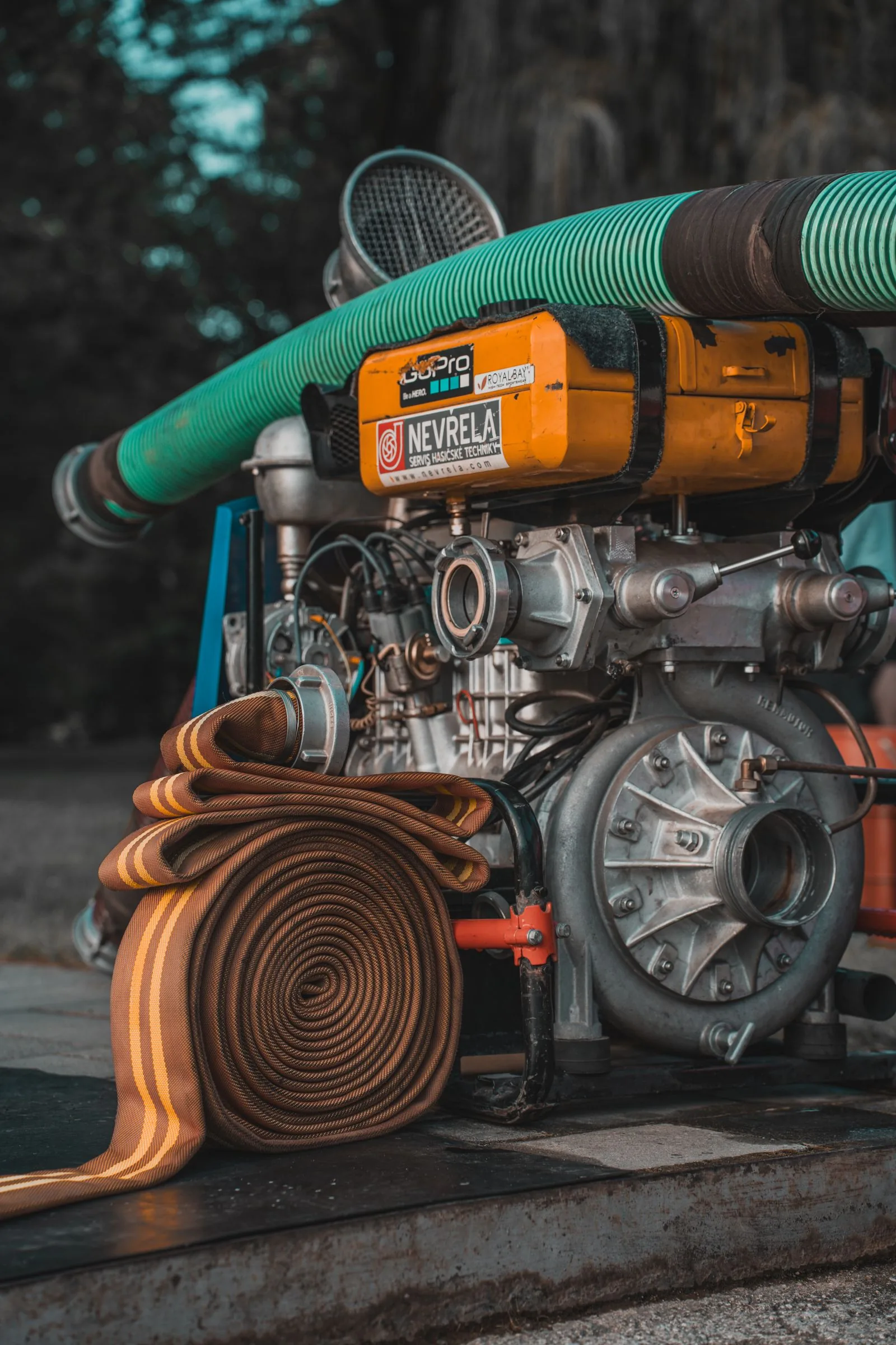 Industrial water pump with coiled hose equipment outdoors
